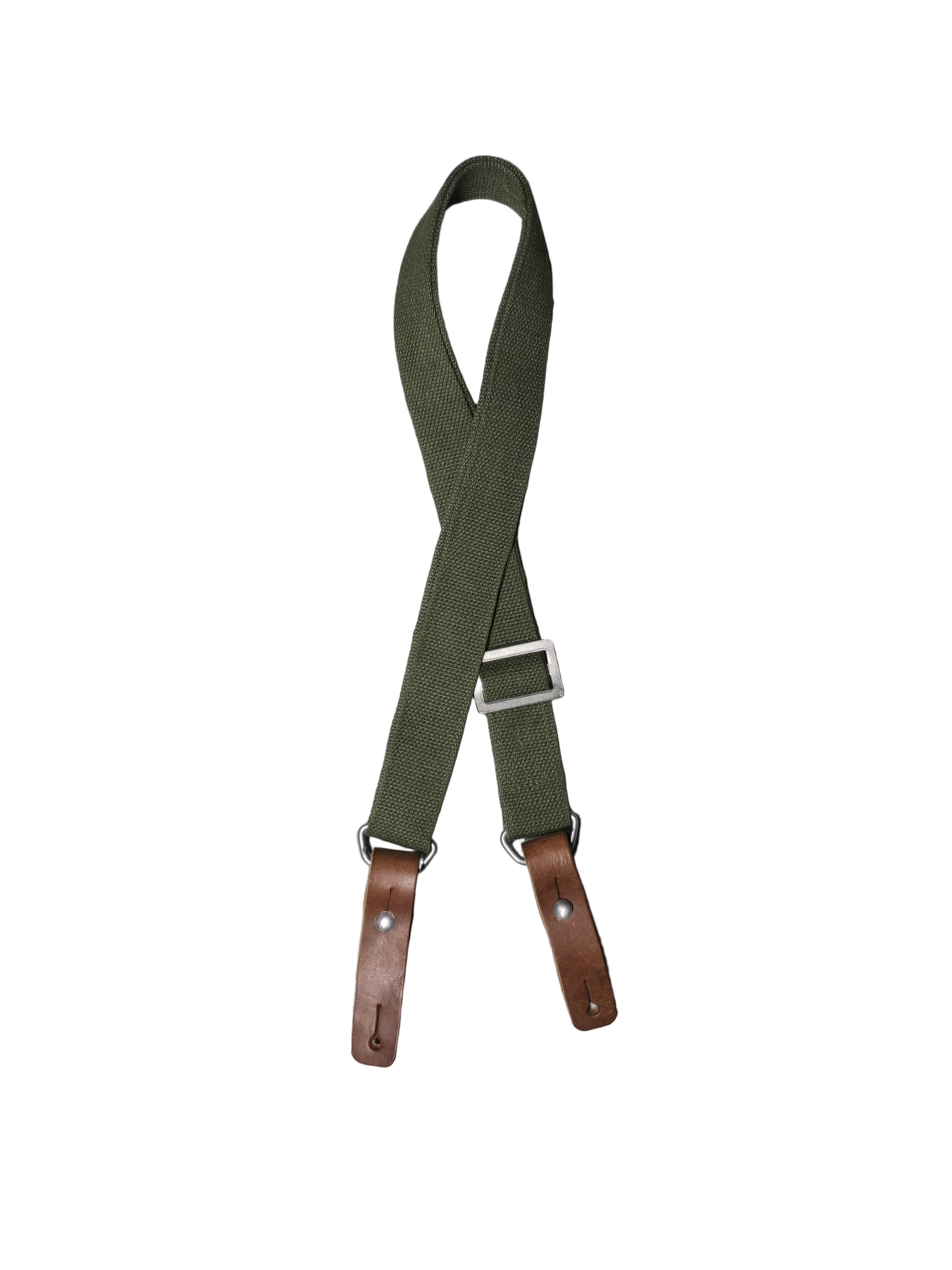 Green sks sling with brown leather straps on a gray background