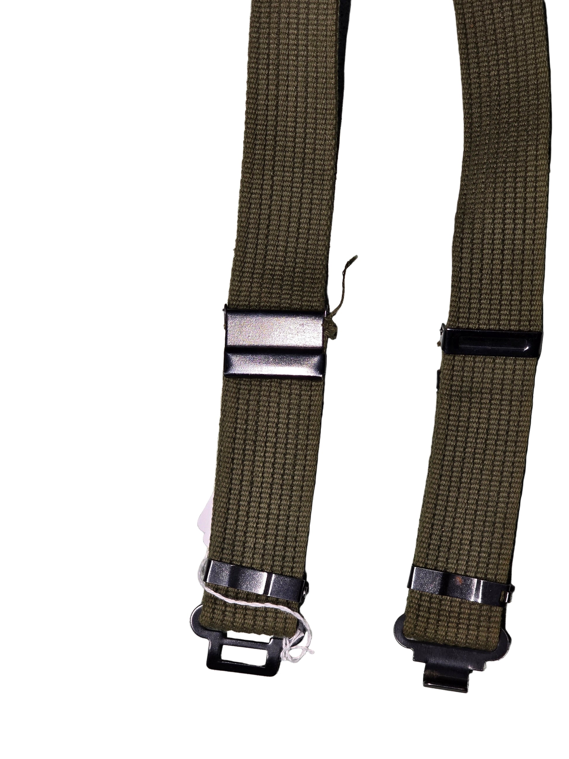 Two green web belts with silver buckles on a gray background