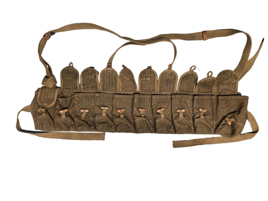 Chinese type 56 sks magazine 10 cell holder Brown leather belt with multiple pouches on a gray surface