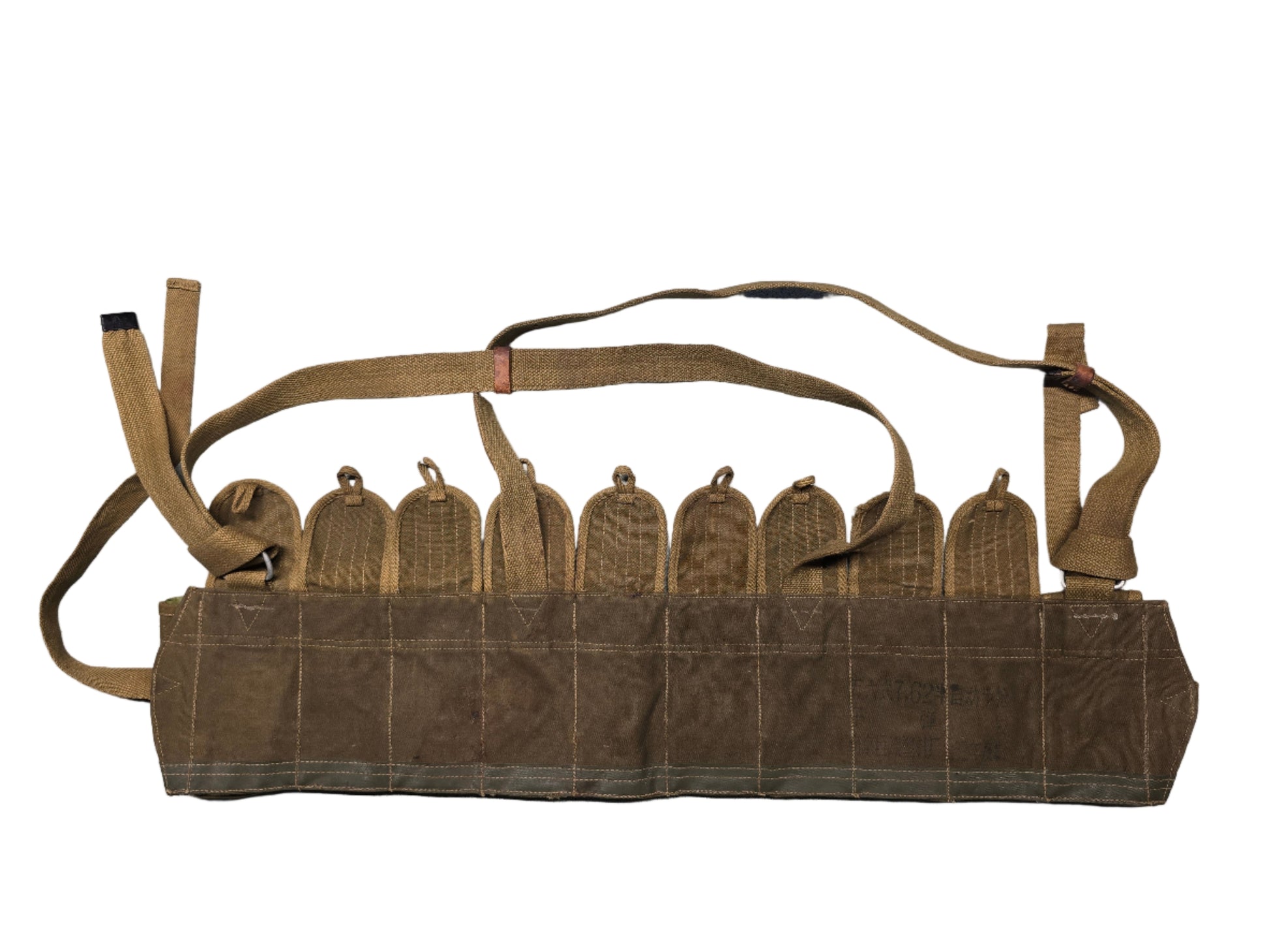 Brown leather gun belt with straps on a gray surface