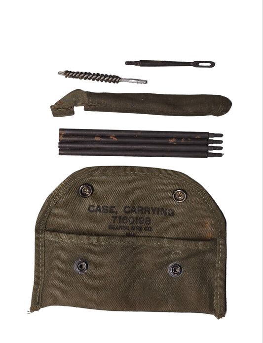 Gun cleaning kit with tools and a case on a white background