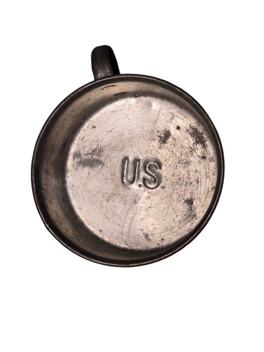 Spanish American war, U.S. tin mug, Metal cup on a gray surface