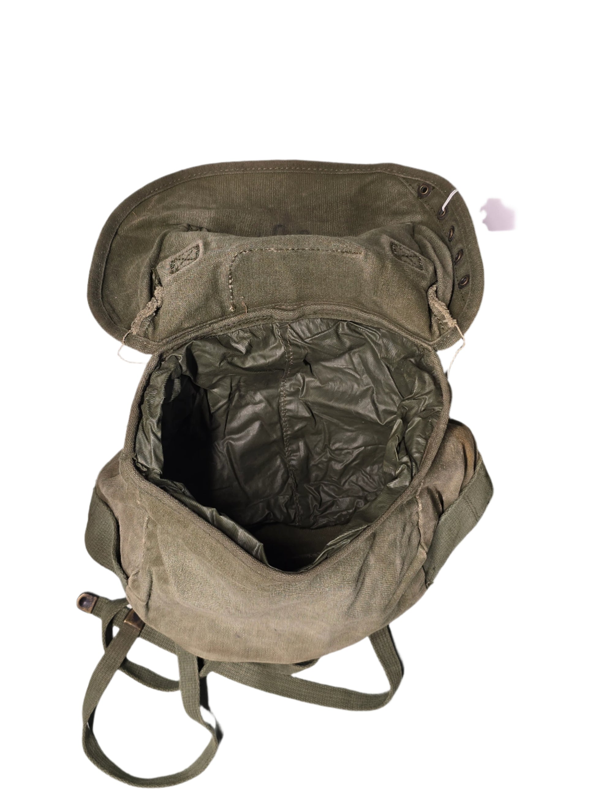 U.S. M-1961 Vietnam War "Field Pack Canvas" Bags Vintage military backpack on a gray background Worn green backpack on a gray background