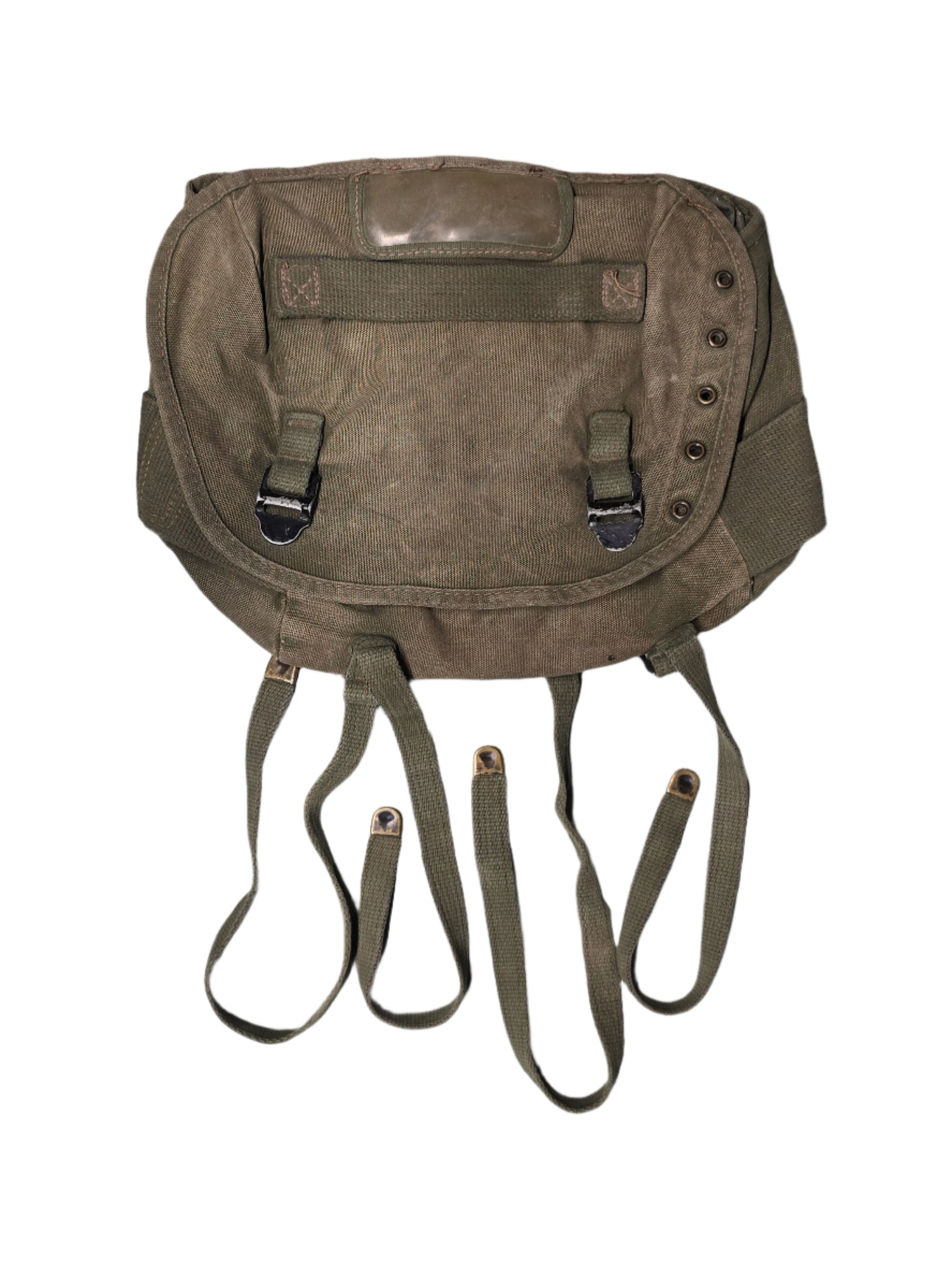 U.S. M-1961 Vietnam War "Field Pack Canvas" Bags Vintage military backpack on a gray background,Brown leather bag with multiple straps on a gray background