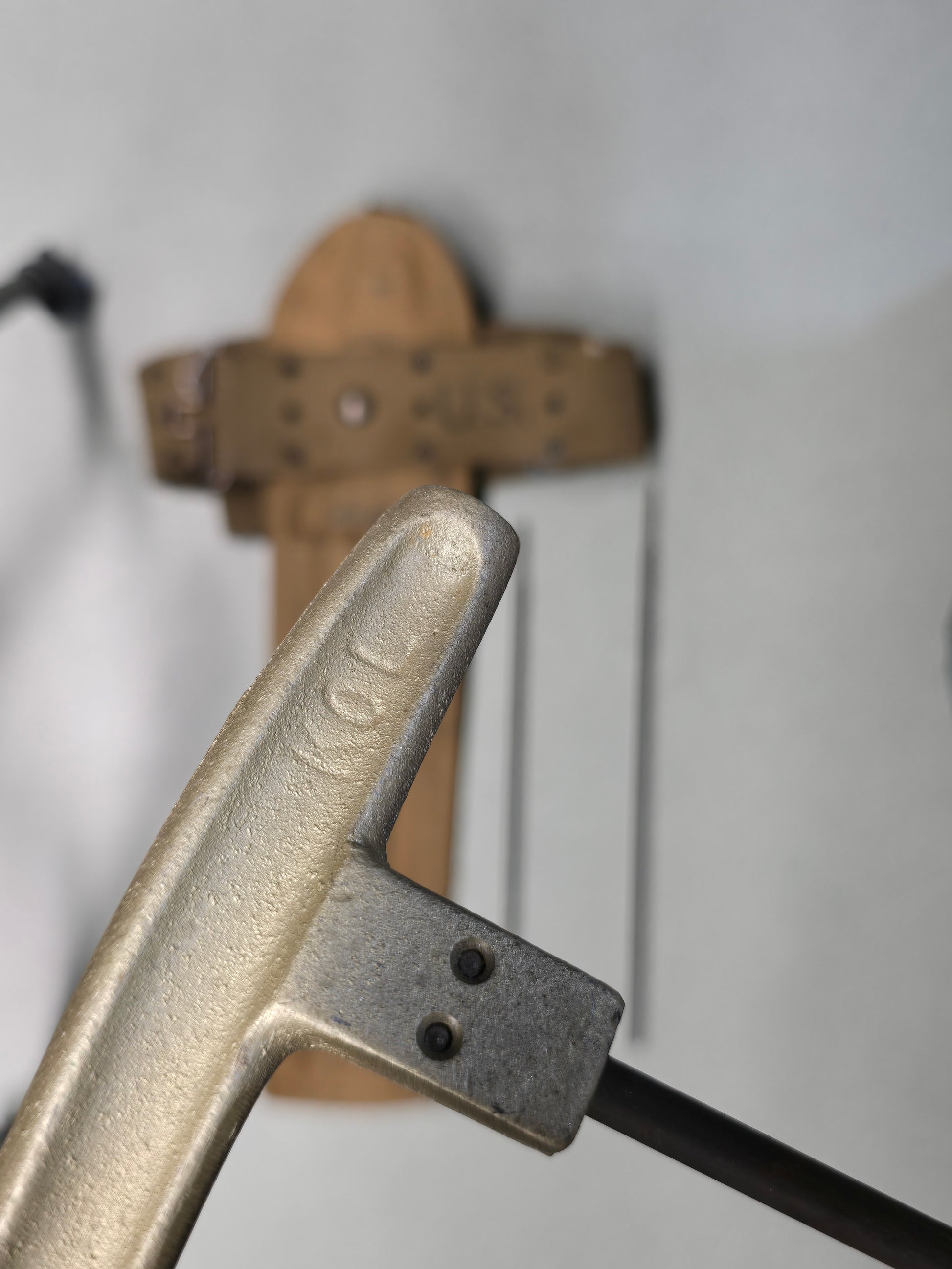 M1 Garand Cleaning Kit with U.S. M1942 Beltiron cleaning handle with '1KOL' marking on a blurred background