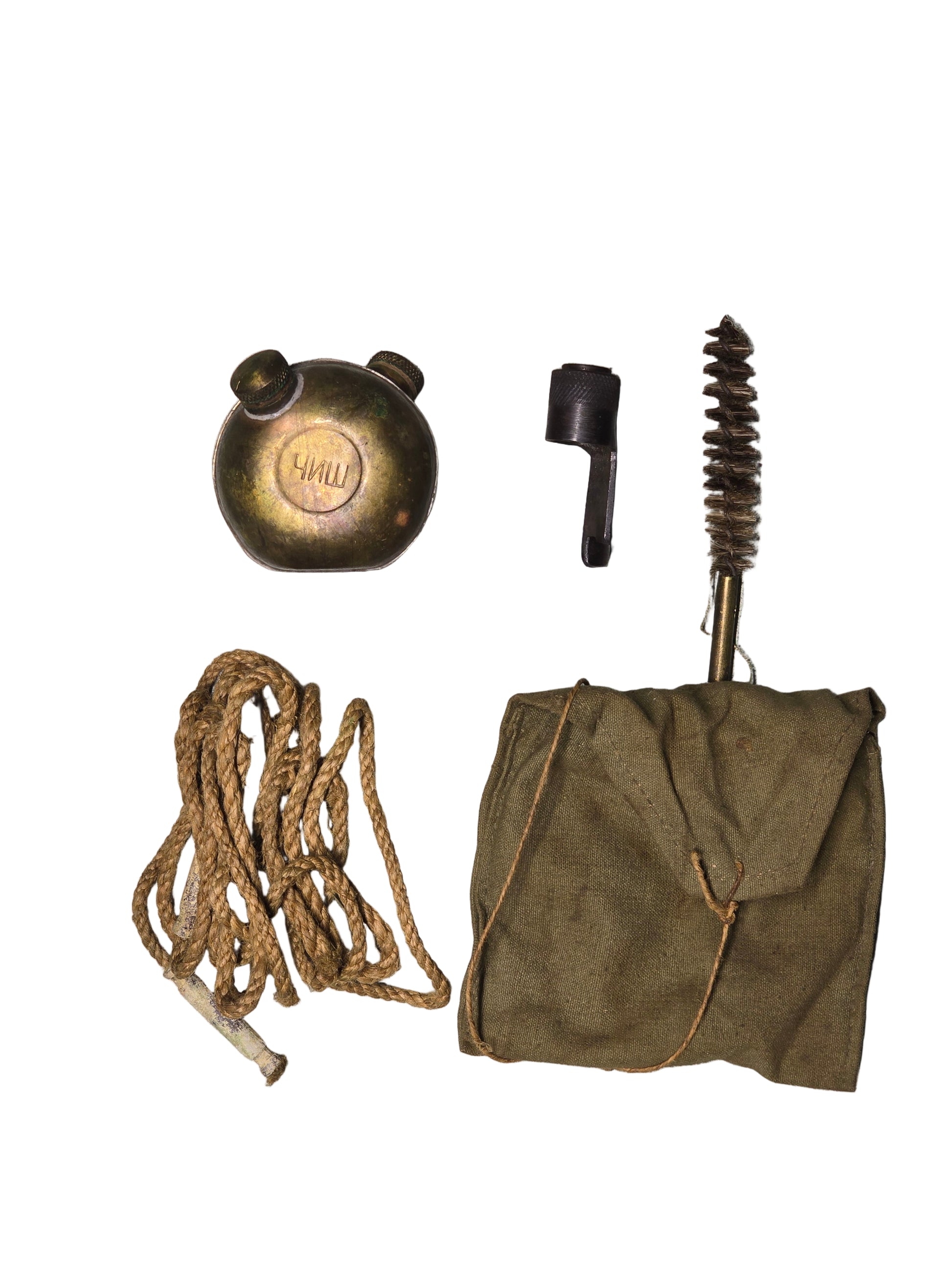 Yugoslavian M48 Mauser Collection of vintage items including a brass bell, rope, and other small objects on a gray surface.