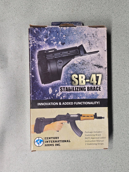 Product packaging for SB-47 stabilizing brace with graphics of a rifle on a gray background