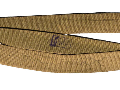 Russian Mosin nagant sling 
Brown belt with a visible brand logo on a gray backgrounds