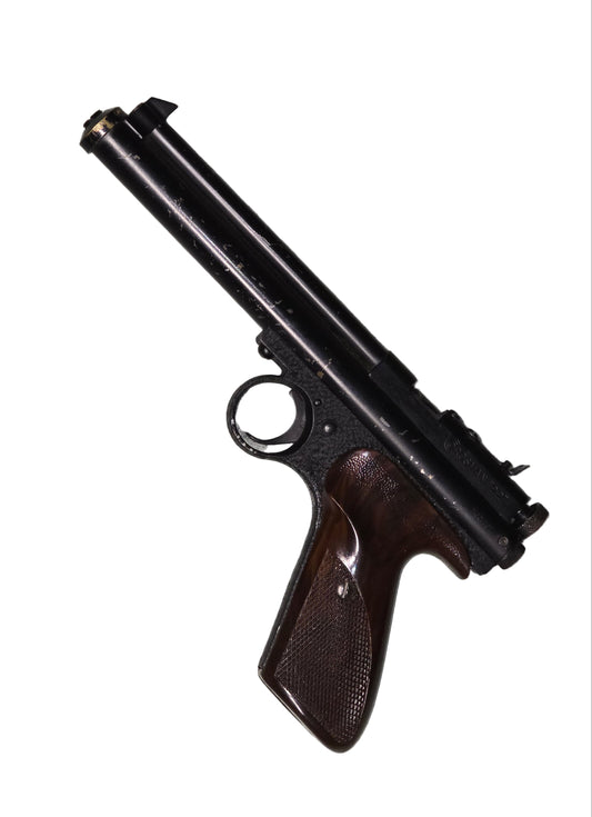 Crossman Model 116 pellet Pistol on a gray surface