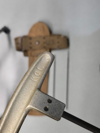 M1 Garand Cleaning Kit with U.S. M1942 Beltiron cleaning handle with '1KOL' marking on a blurred background 